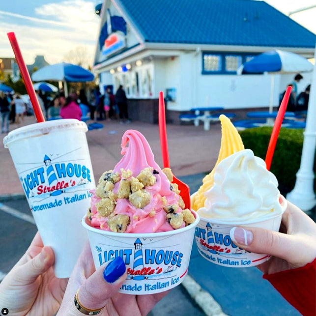Strollo's Lighthouse treats, including a vanilla shake, strawberry Italian Ice with cookie dough topping, and mango Italian Ice with vanilla soft serve ice cream