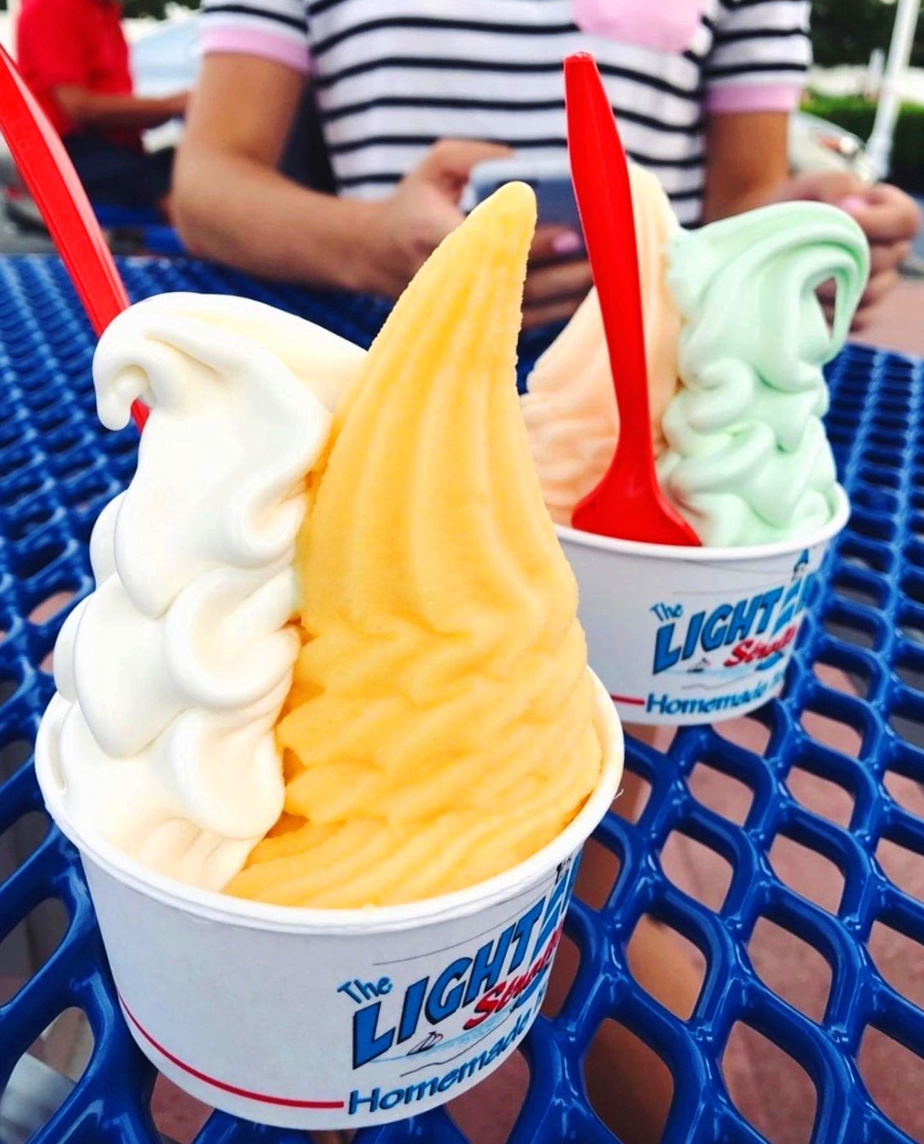 Two Strollo's Lighthouse cups with homemade Italian Ice and soft serve ice cream