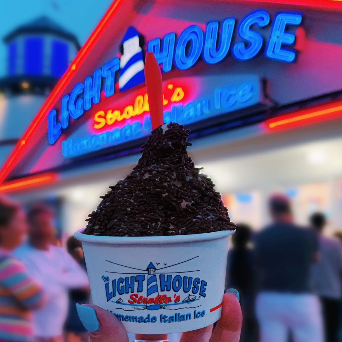 A Strollo's Lighthouse soft serve ice cream cup with chocolate sprinkles