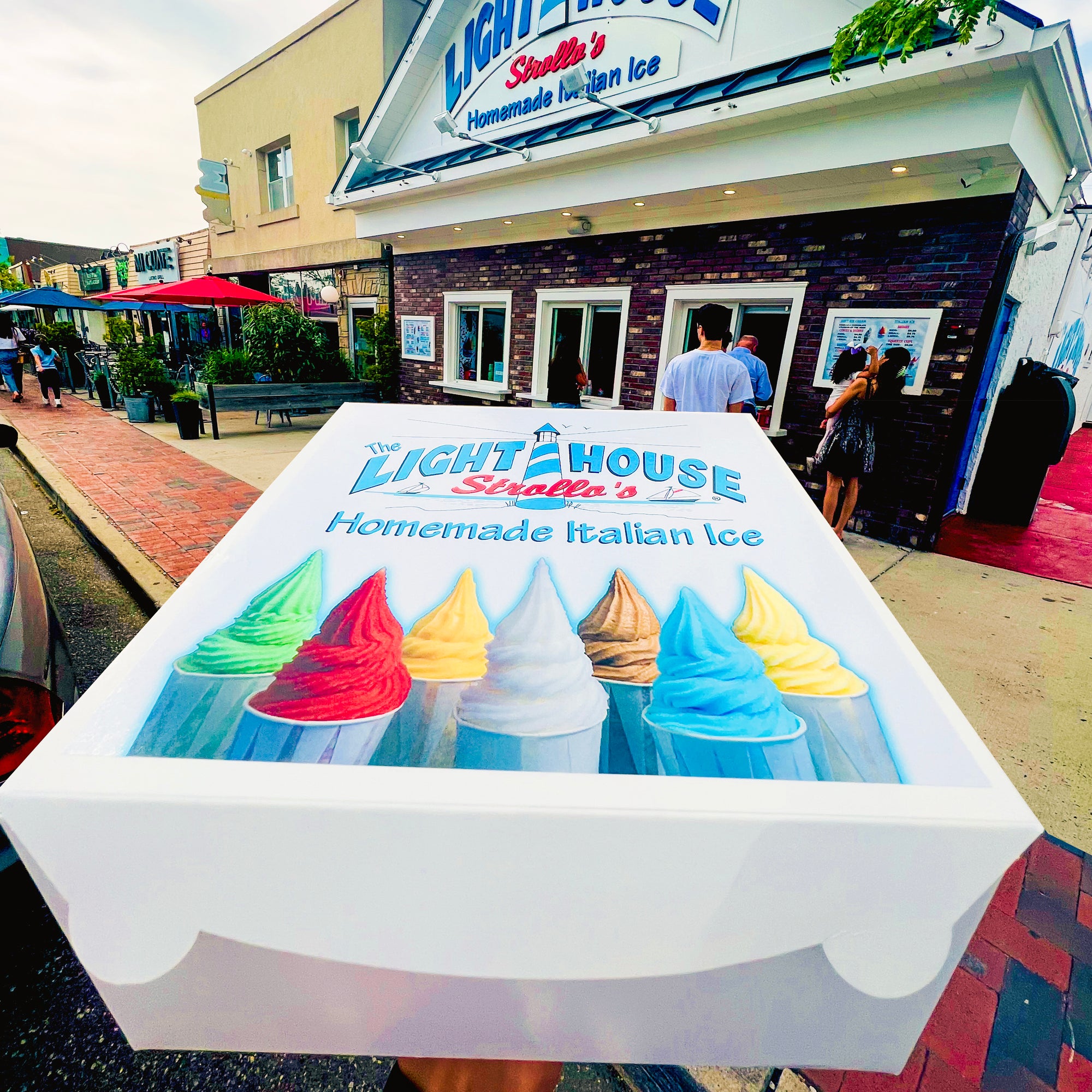 A Strollo's Lighthouse party box of soft serve Italian Ice cups